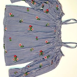 Cute long sleeve off the shoulder with straps.